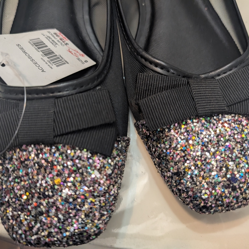 Accessorize Black Flats with Modern Elegance